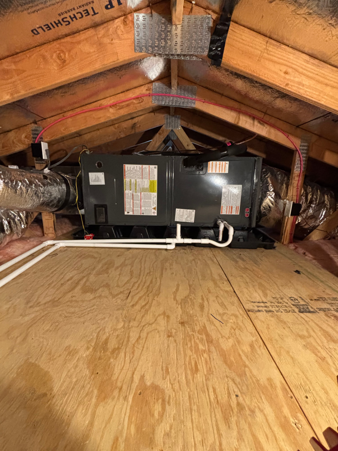 New attic air handler and coil installed with sealed ductwork